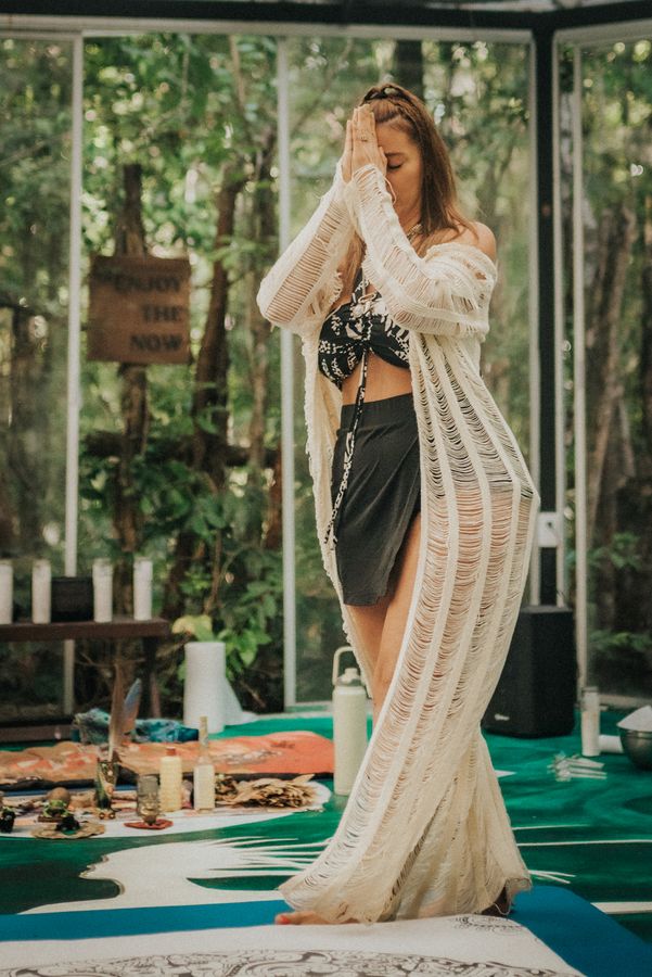 Morning practice in a glass shala surrounded by jungle