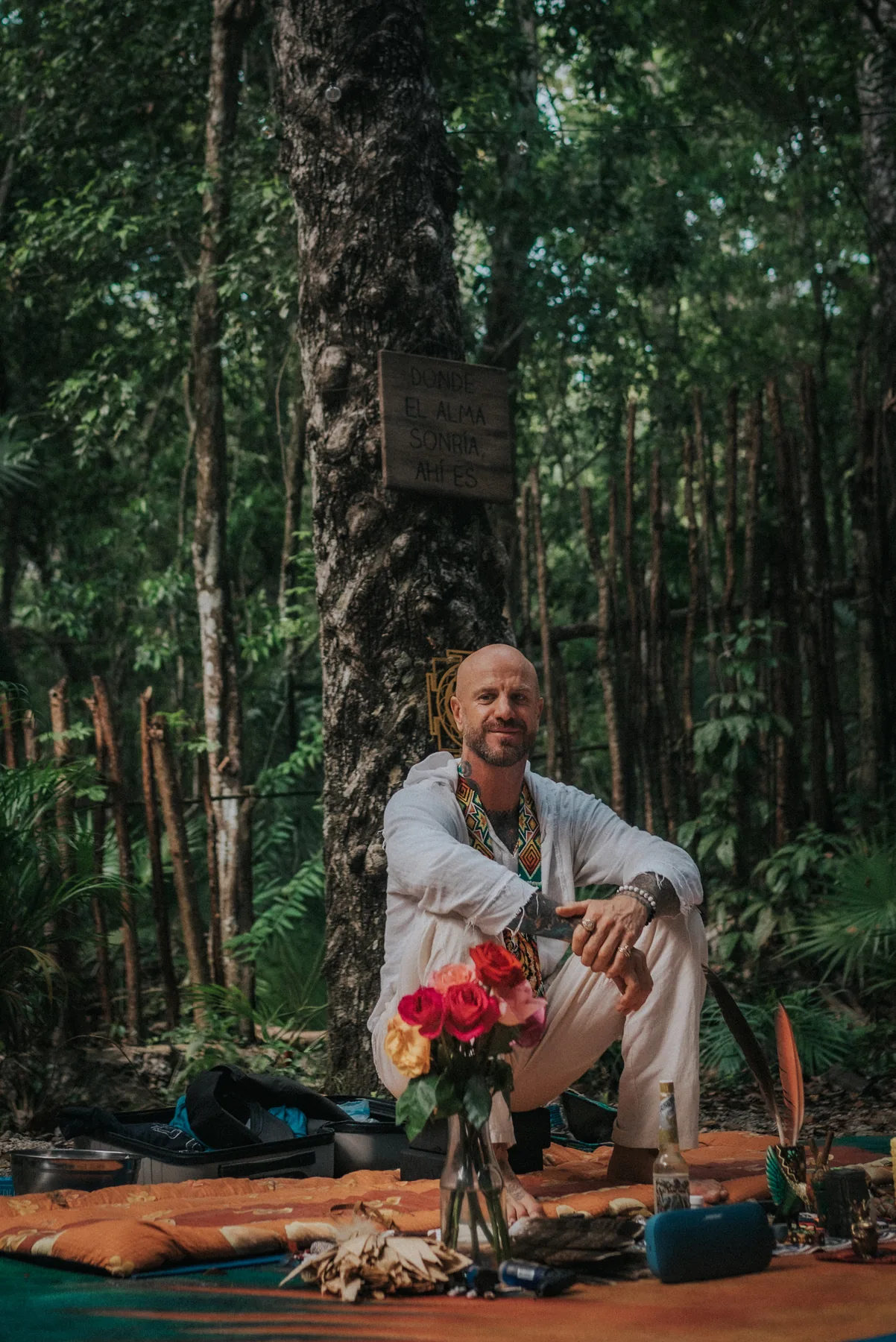 Blaine, founder of Tiger Soul, seated at a ceremony altar in the jungle