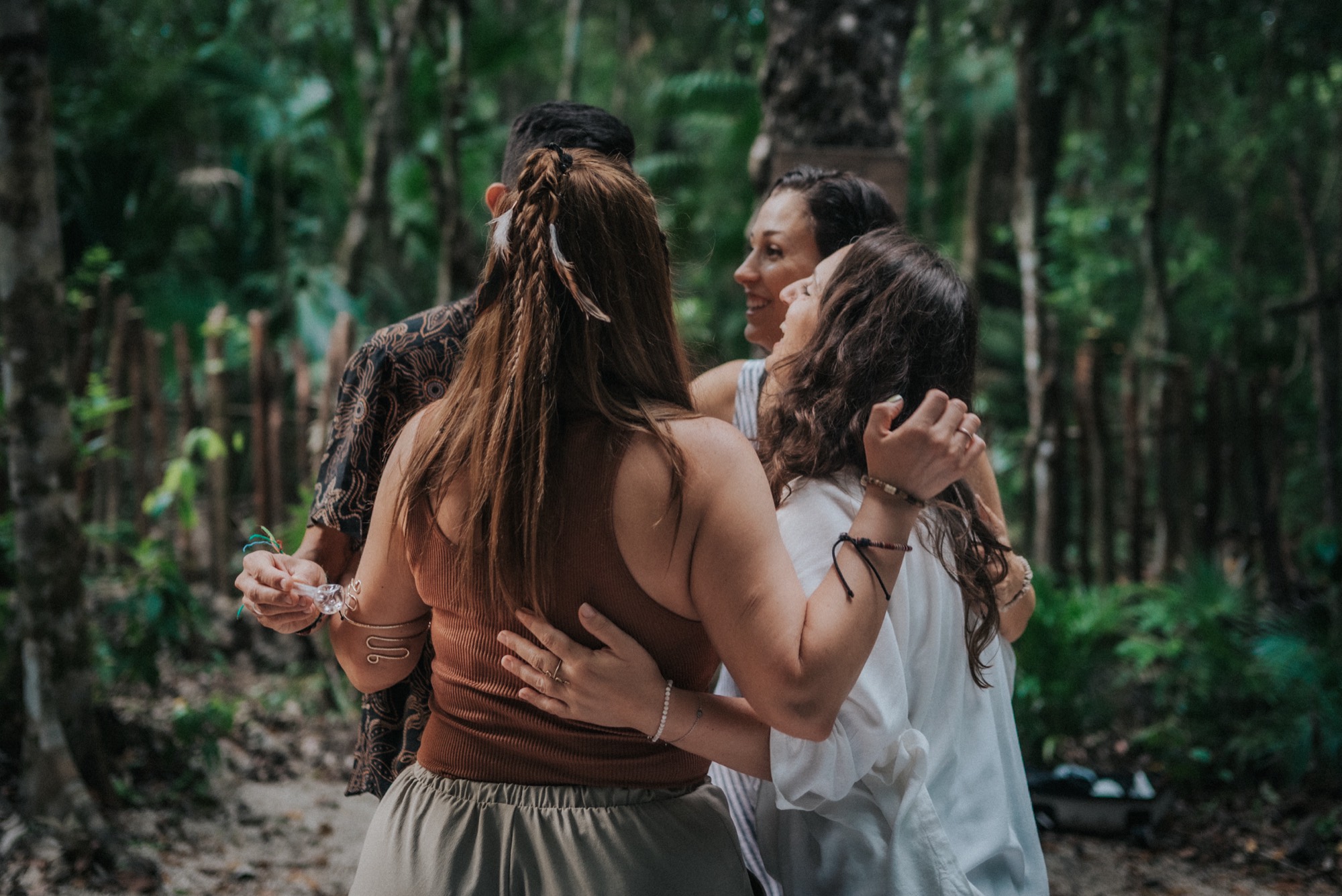 A group embracing in the jungle after ceremony