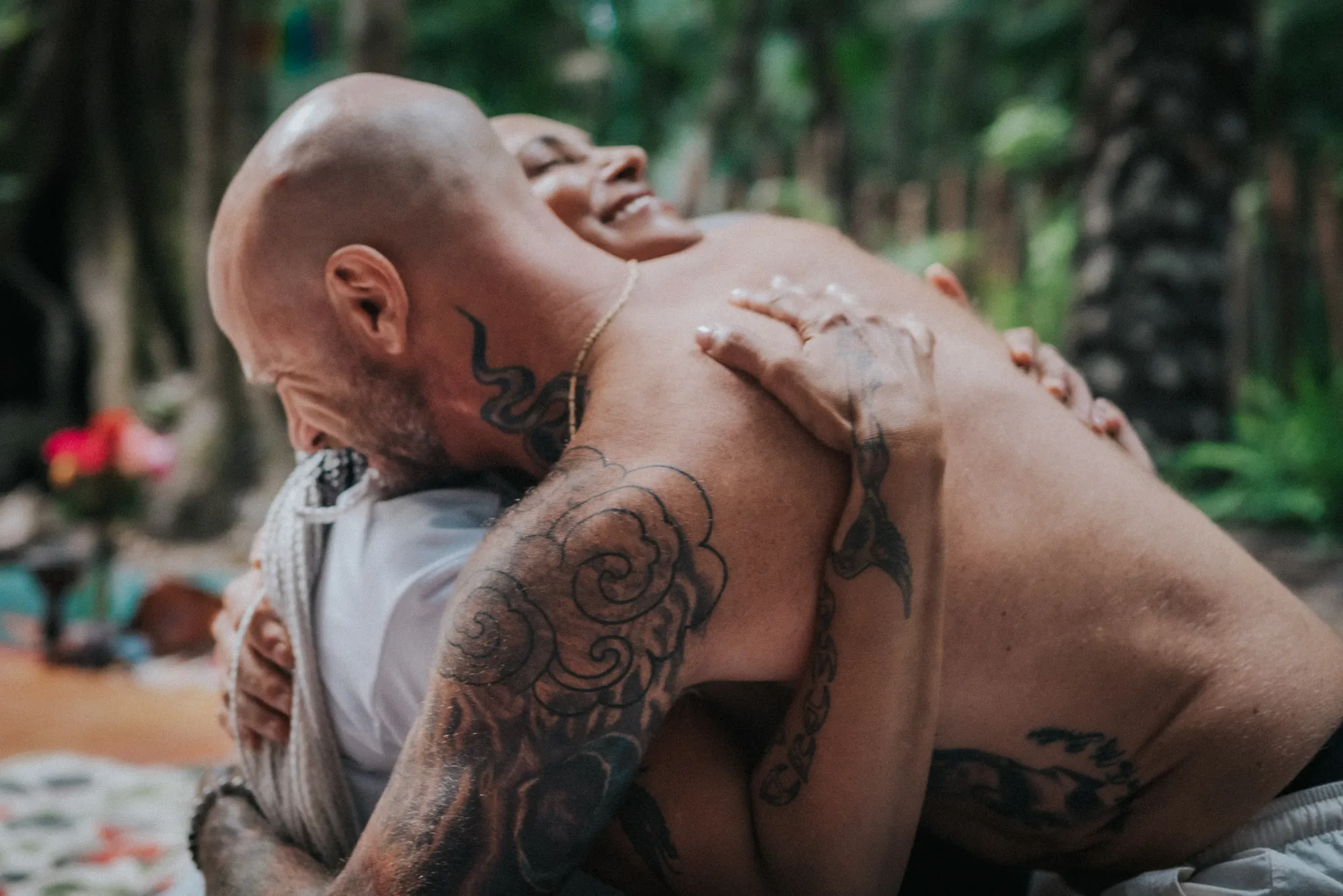 Two people in a joyful embrace during ceremony