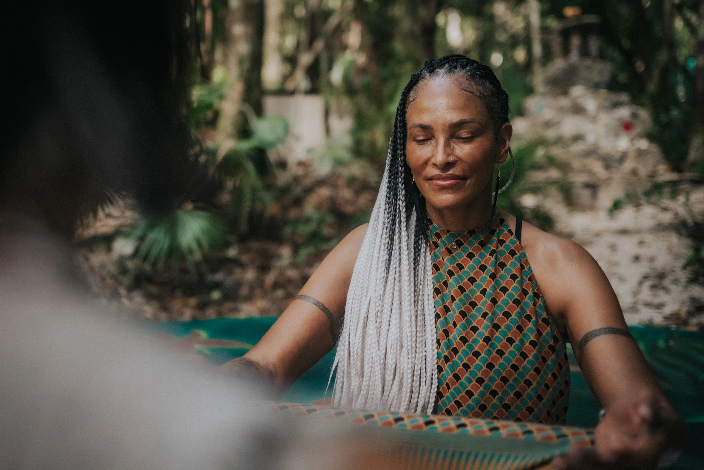 A serene moment of meditation by the water at a jungle retreat